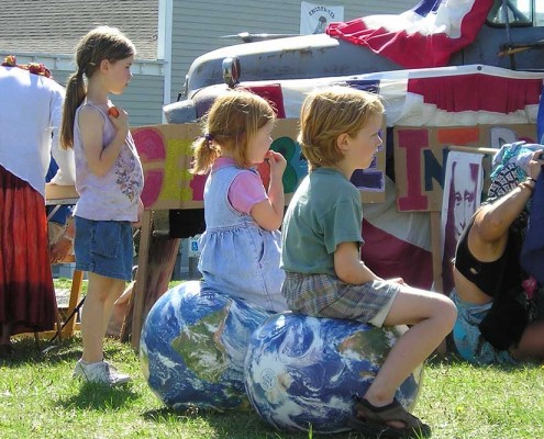 Children's Peace Rally Children sitting on two 16-inch EarthBalls