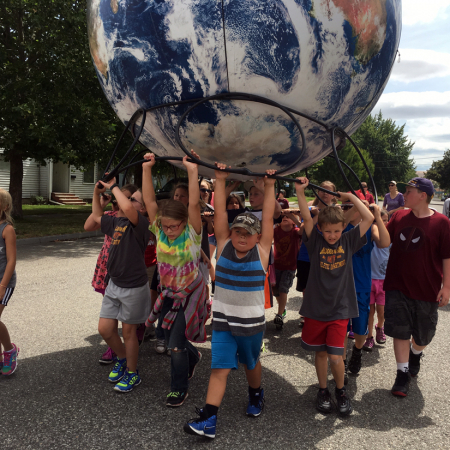 daytonkids2 Giant Globes Inflatable Earthballs carried by Kids in Dayton