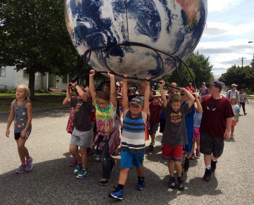 daytonkids2 Giant Globes Inflatable Earthballs carried by Kids in Dayton